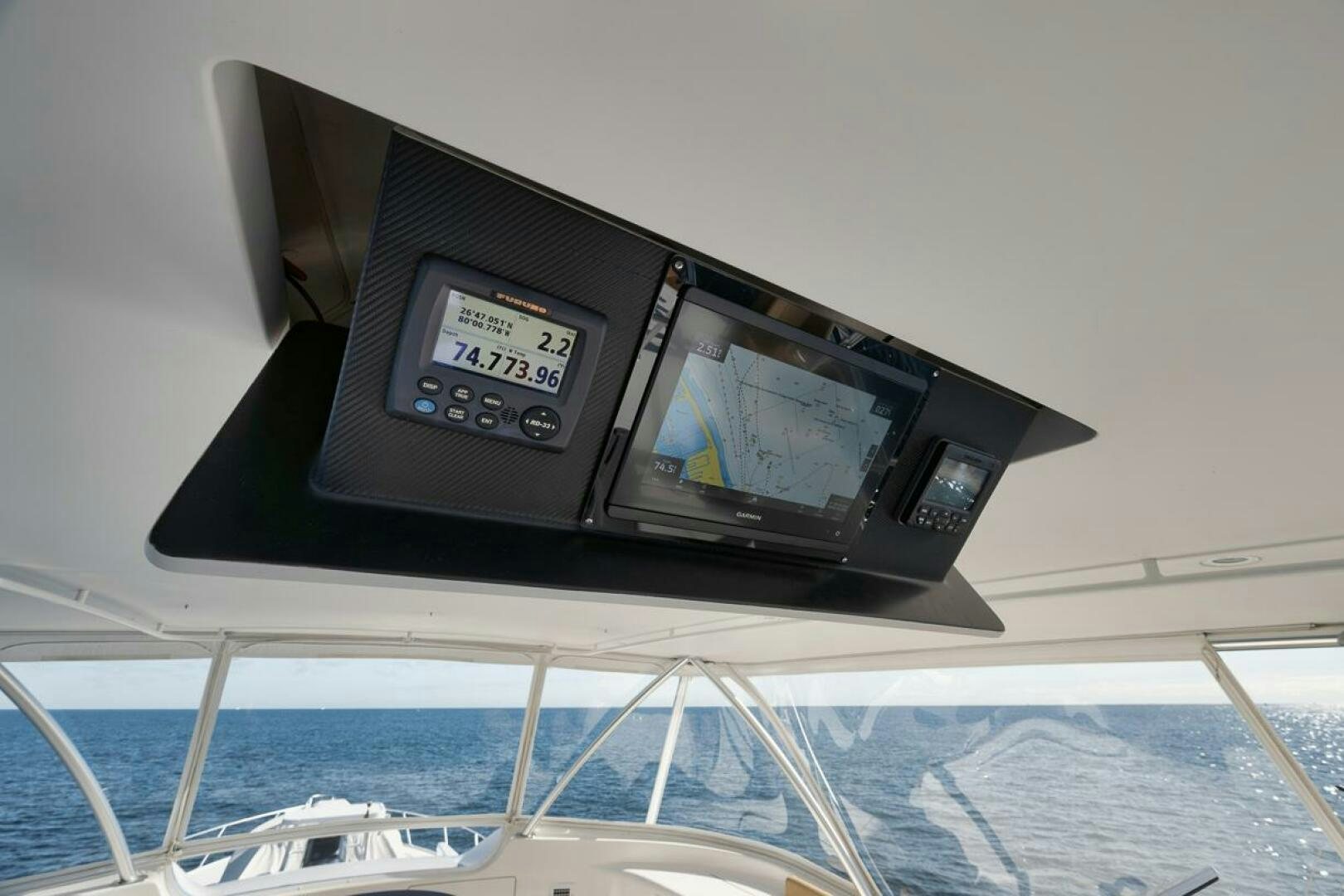 a black electronic device on a white surface aboard SWEETUMS Yacht for Sale