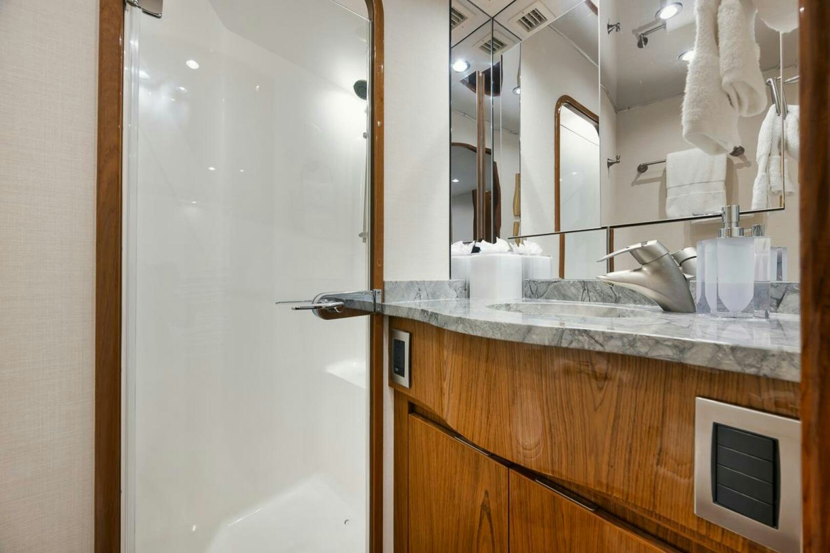 a bathroom with a sink and a mirror aboard SWEETUMS Yacht for Sale