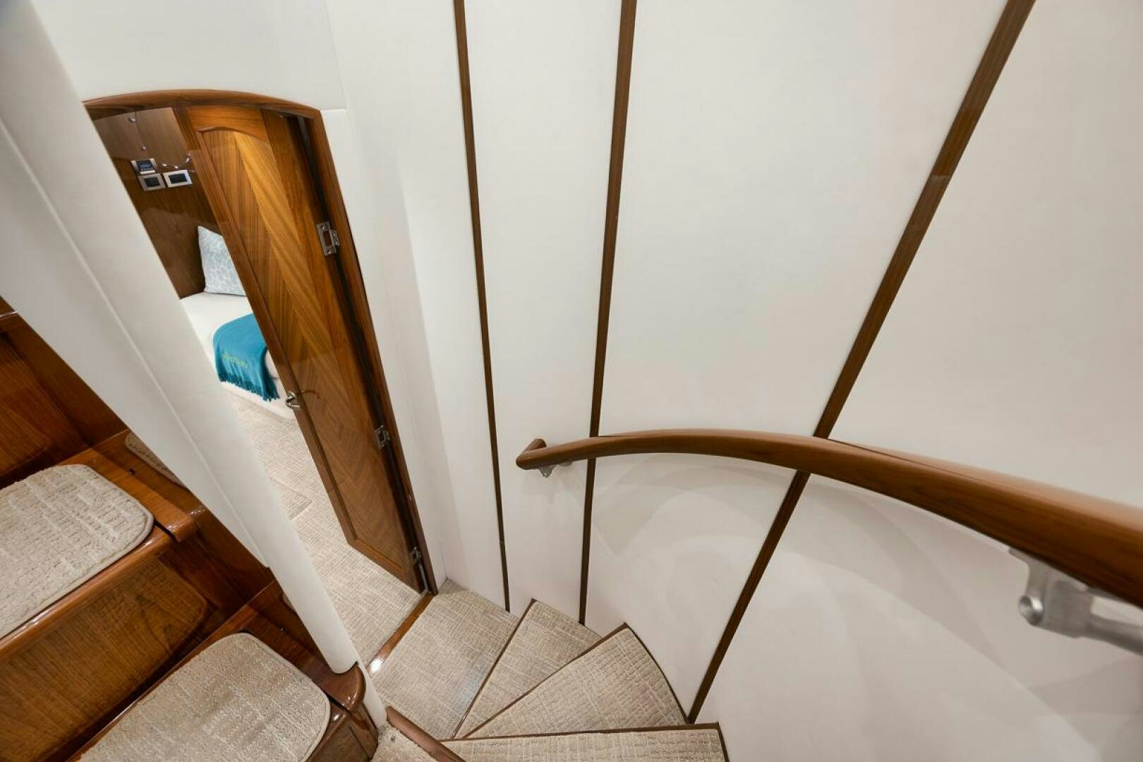 a wooden staircase with a wood railing aboard SWEETUMS Yacht for Sale