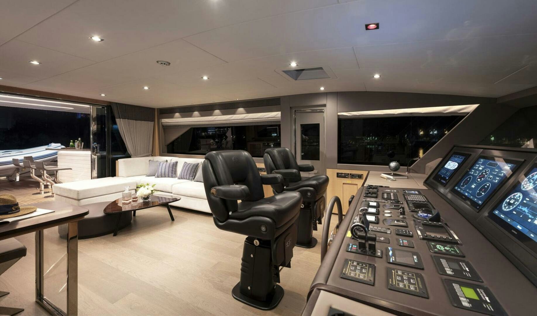 a room with a couch and a television aboard ICE Yacht for Sale