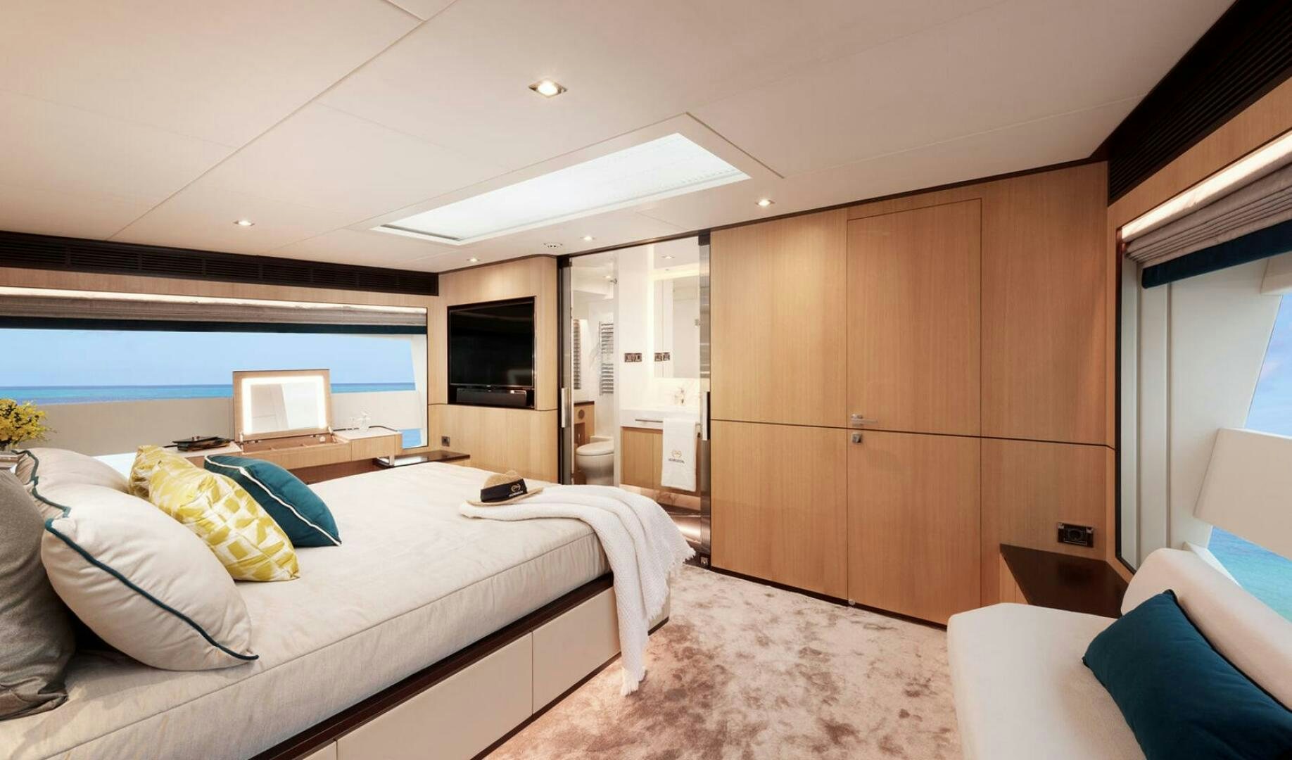 a room with a bed and a television aboard ICE Yacht for Sale
