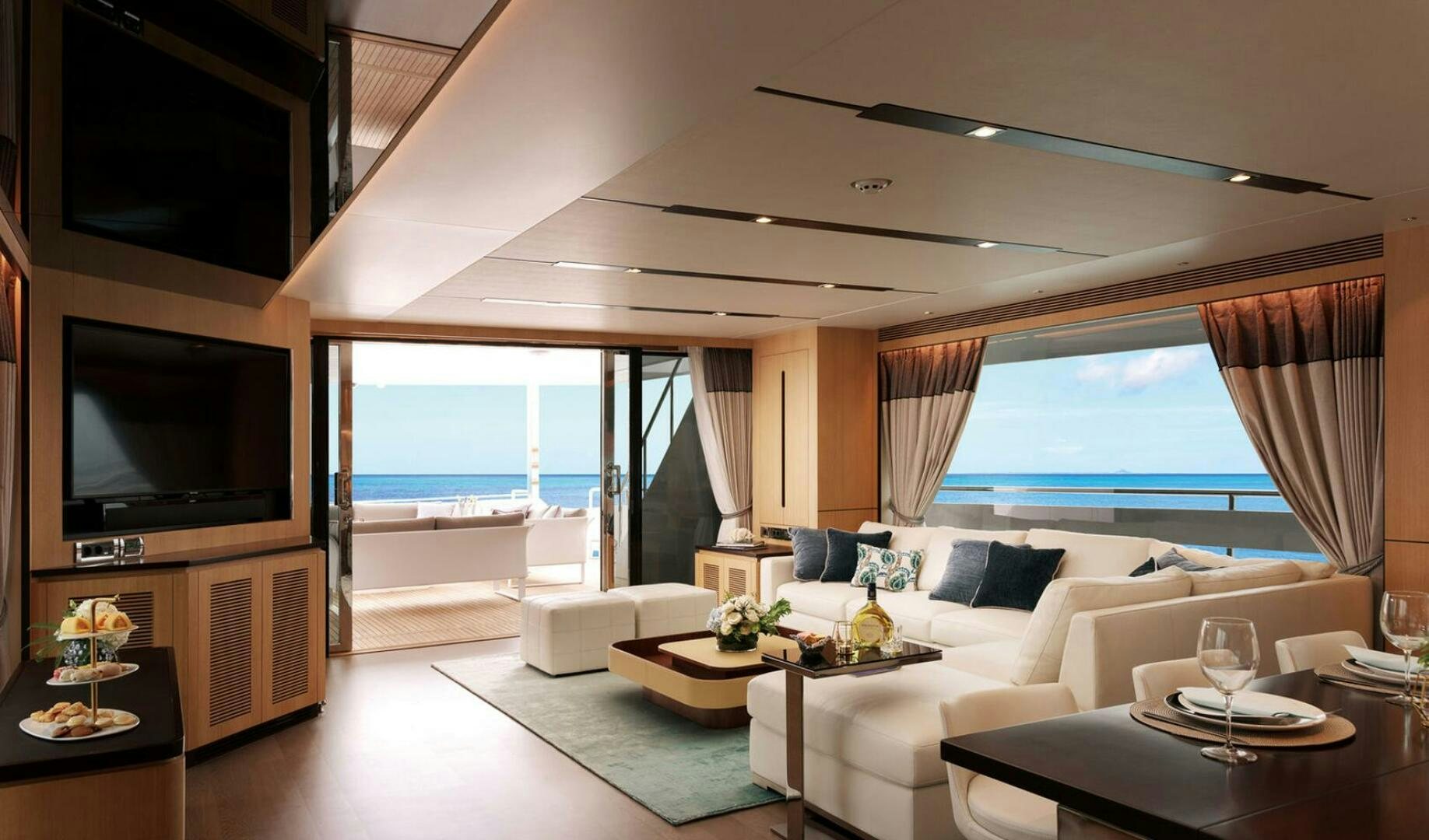 a living room with a large window aboard ICE Yacht for Sale