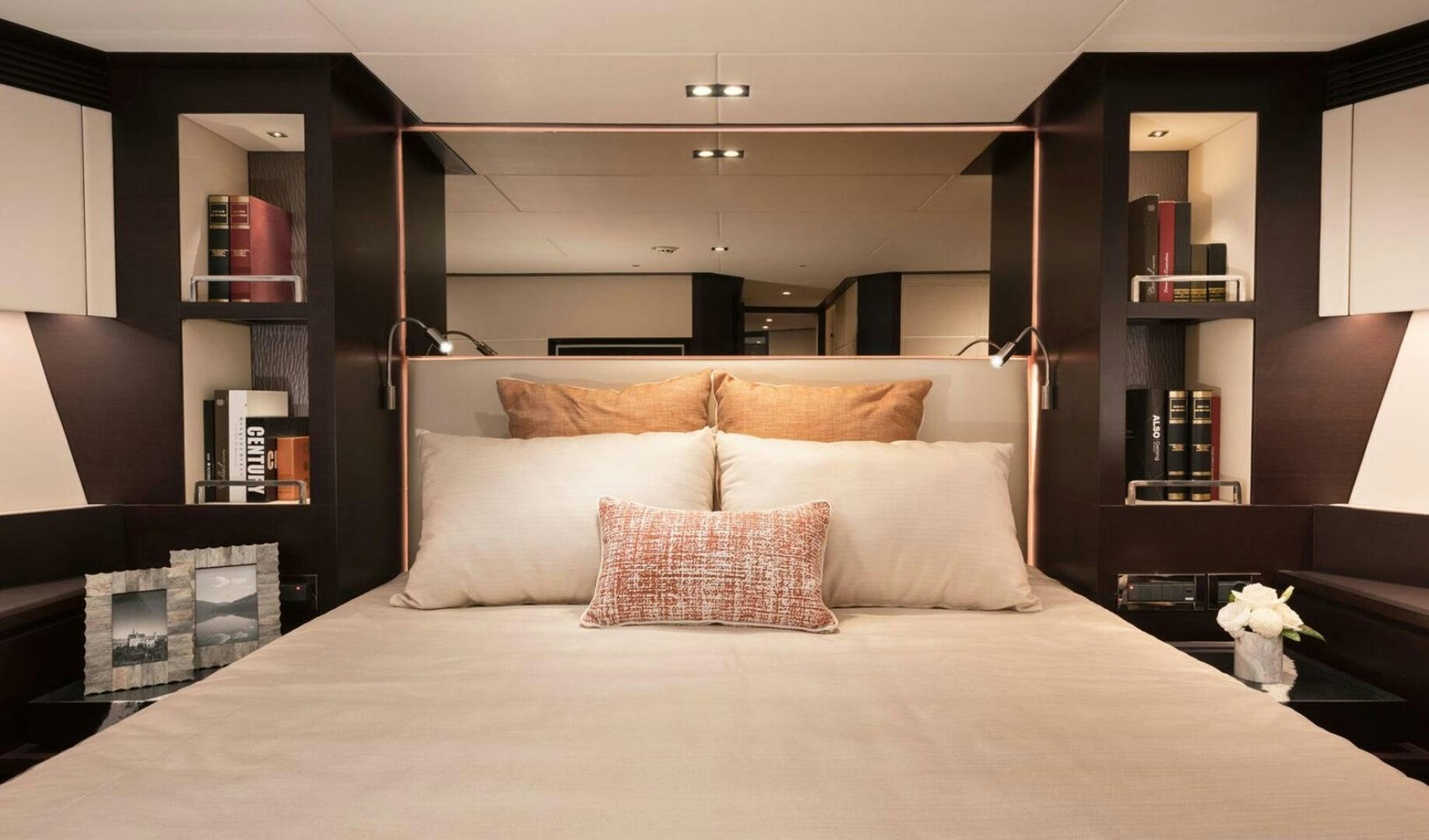 a bed with pillows aboard ICE Yacht for Sale