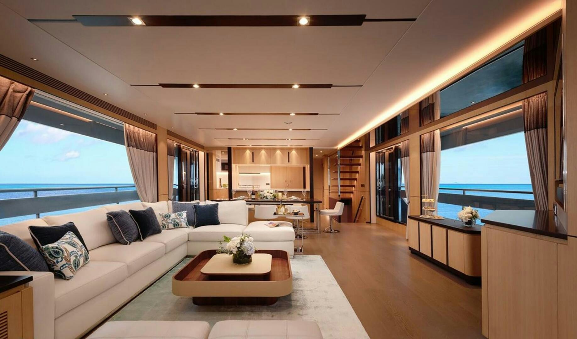 a living room with a large window aboard ICE Yacht for Sale