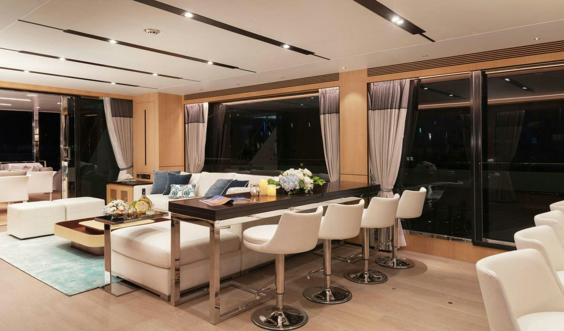 a large modern living room aboard ICE Yacht for Sale