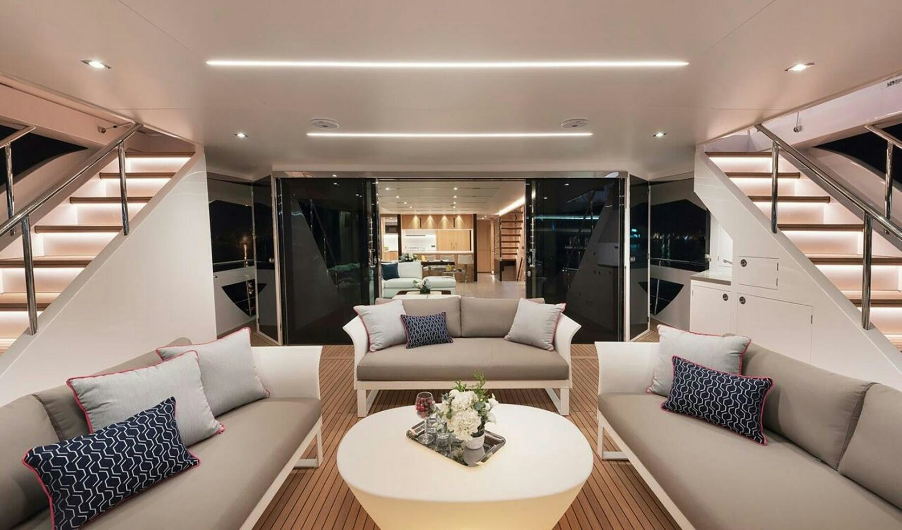 a living room with a staircase aboard ICE Yacht for Sale