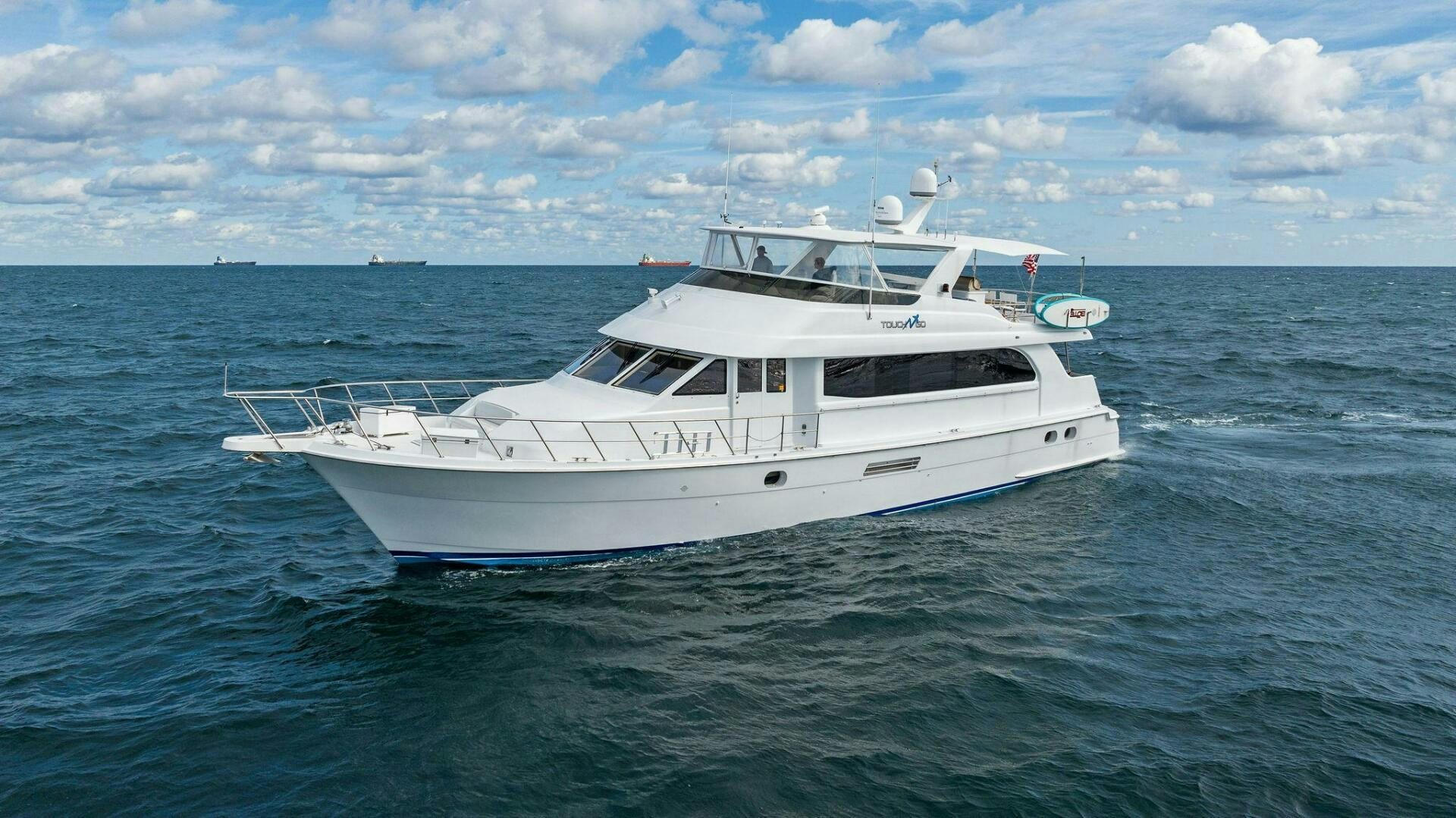 a white boat in the water aboard TOUCH N GO Yacht for Sale