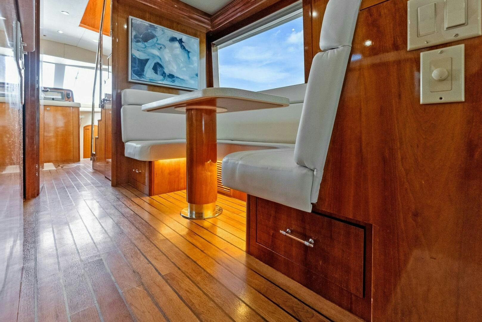 a room with a chair and a table aboard TOUCH N GO Yacht for Sale