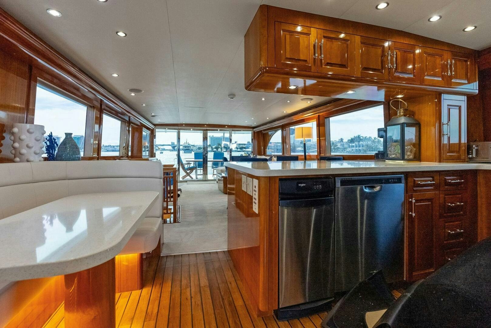 a large kitchen with wooden cabinets aboard TOUCH N GO Yacht for Sale
