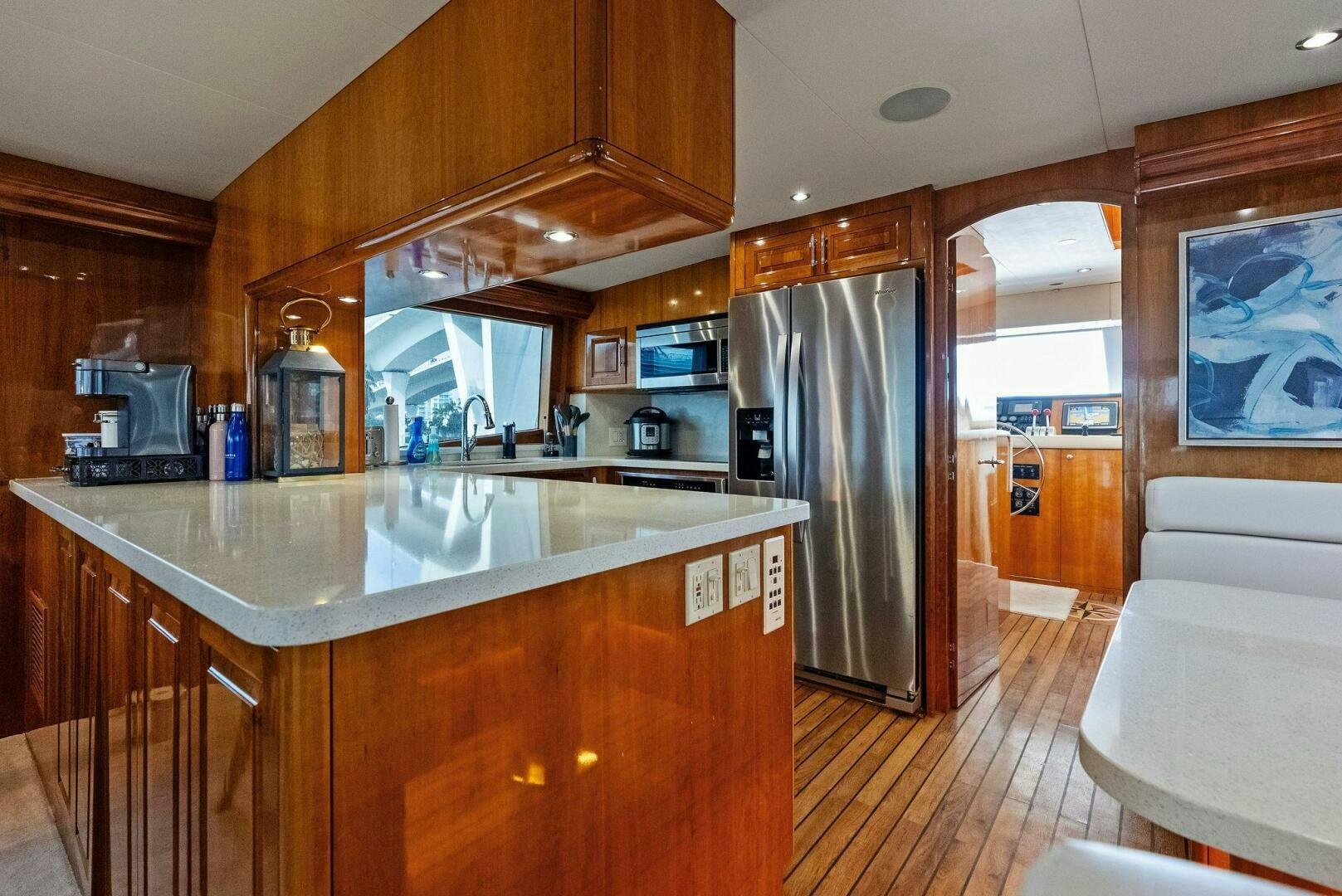 a kitchen with a large island aboard TOUCH N GO Yacht for Sale