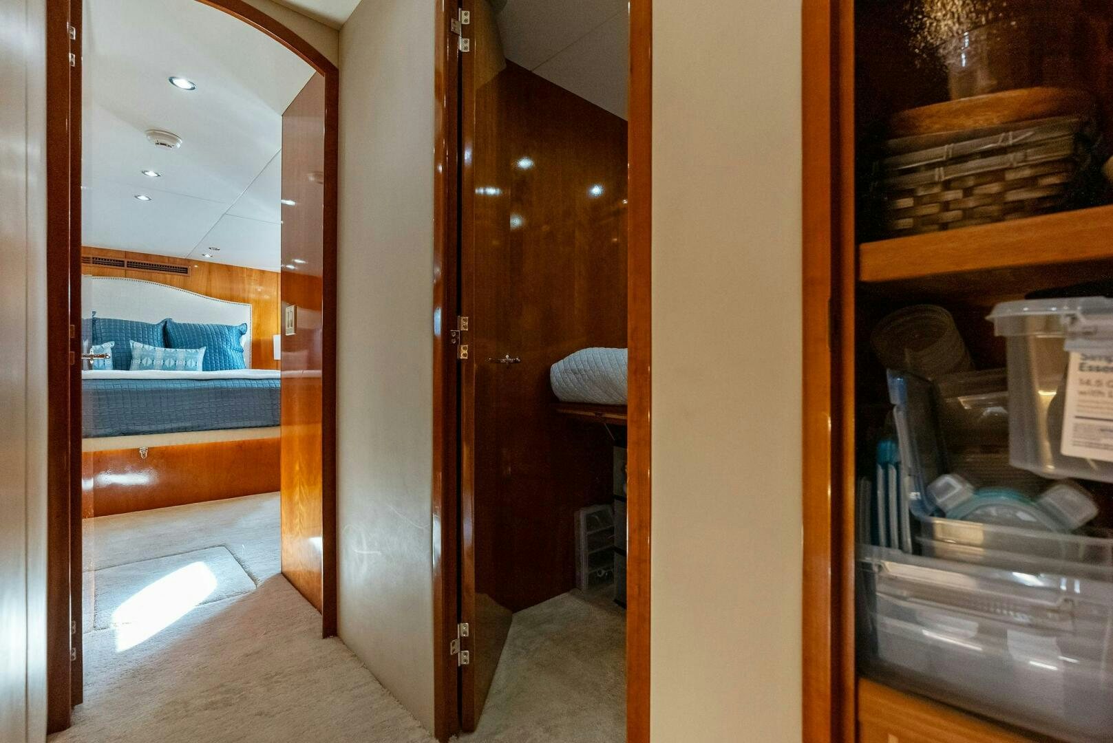 a room with a closet and shelves aboard TOUCH N GO Yacht for Sale