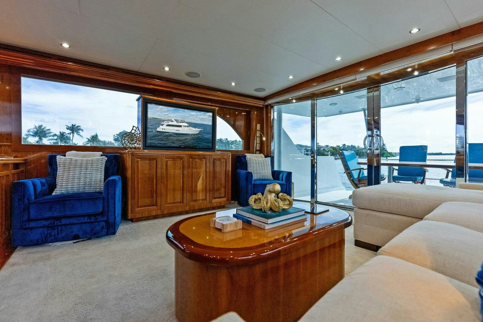 a living room with a large window aboard TOUCH N GO Yacht for Sale