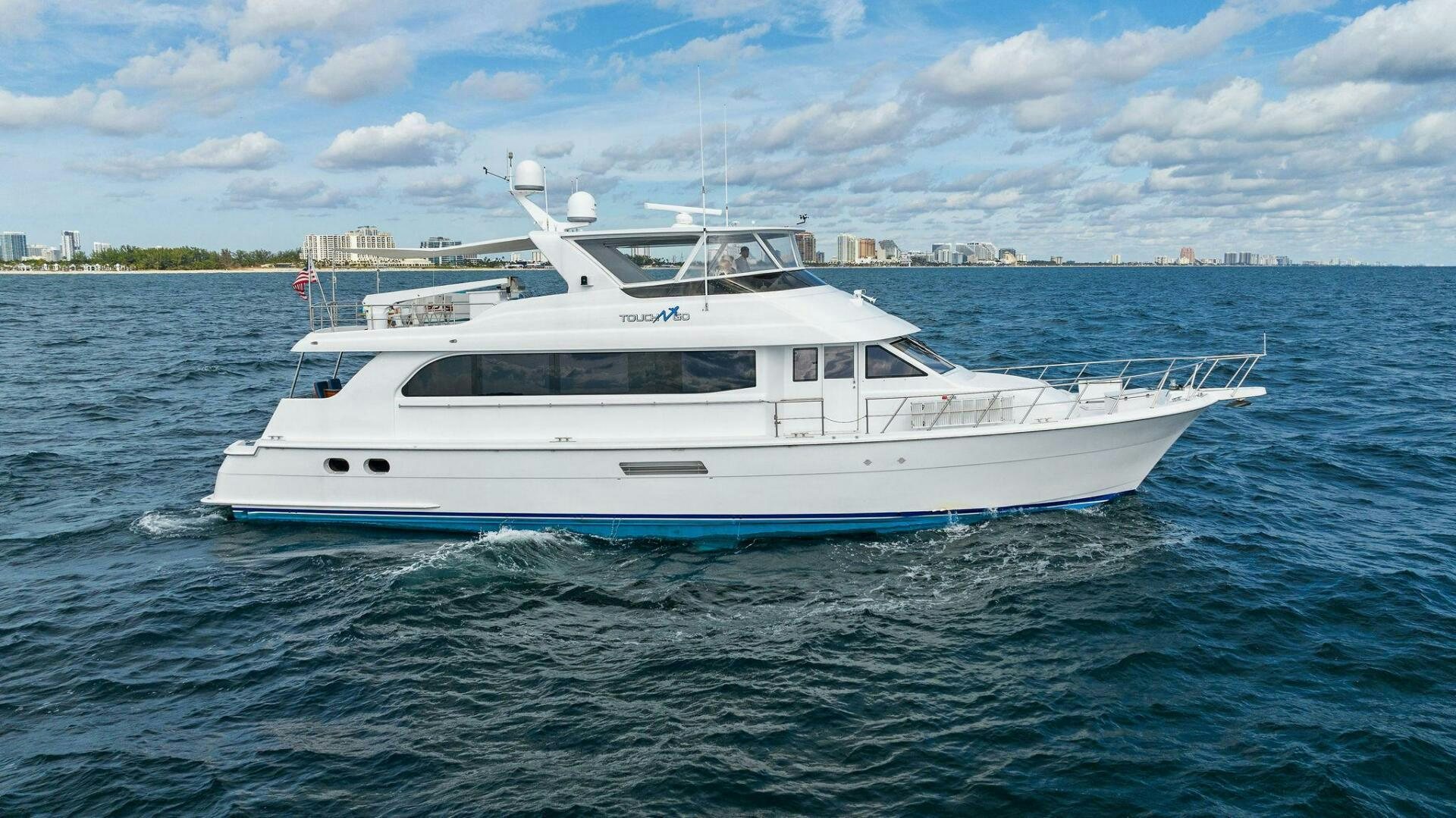 a white yacht in the water aboard TOUCH N GO Yacht for Sale