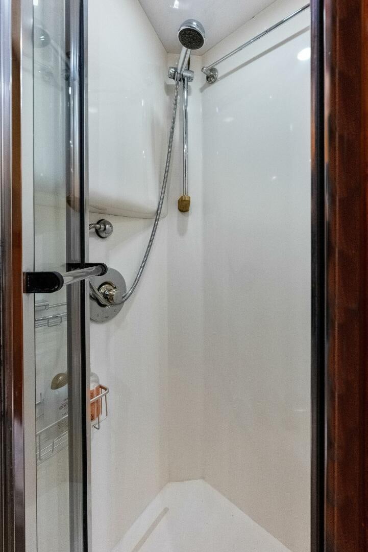 a shower with a glass door aboard TOUCH N GO Yacht for Sale