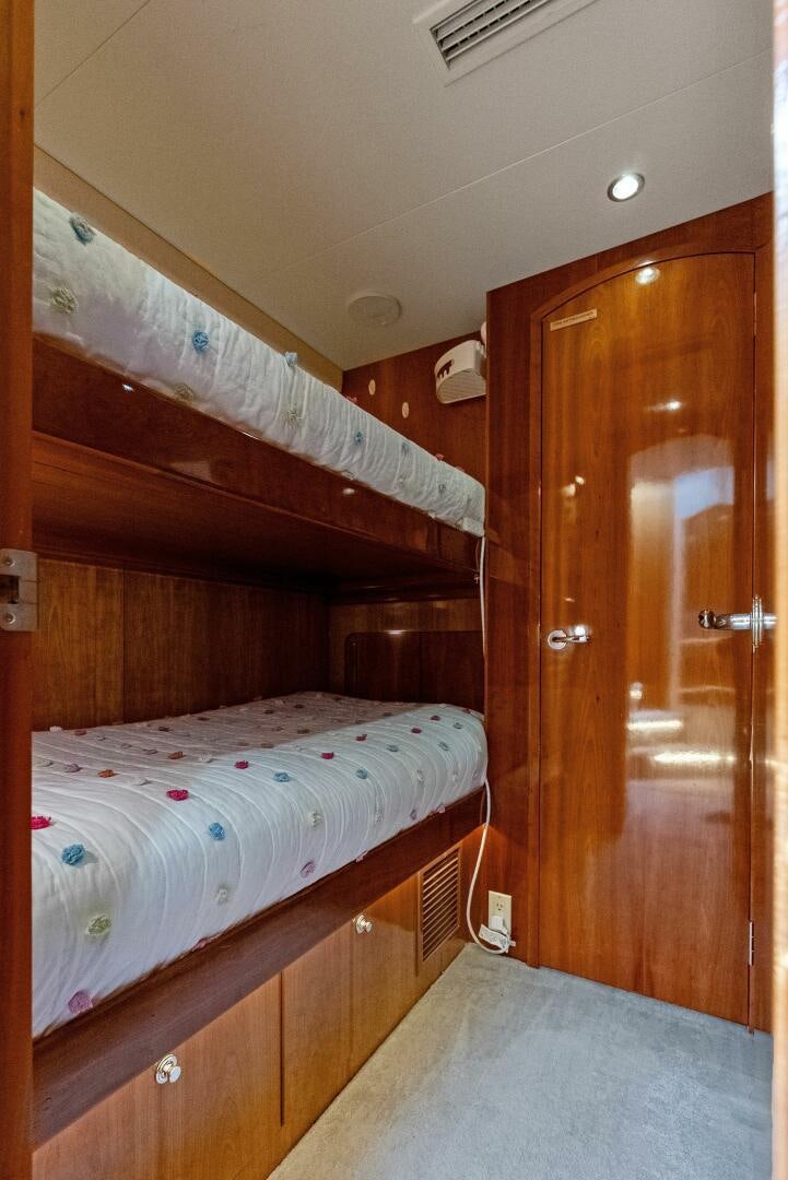 a bed in a room aboard TOUCH N GO Yacht for Sale