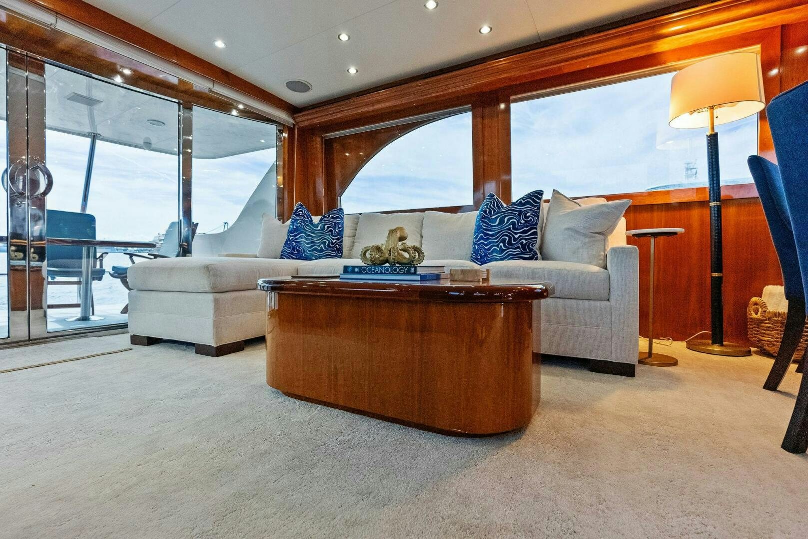 a living room with a large window aboard TOUCH N GO Yacht for Sale