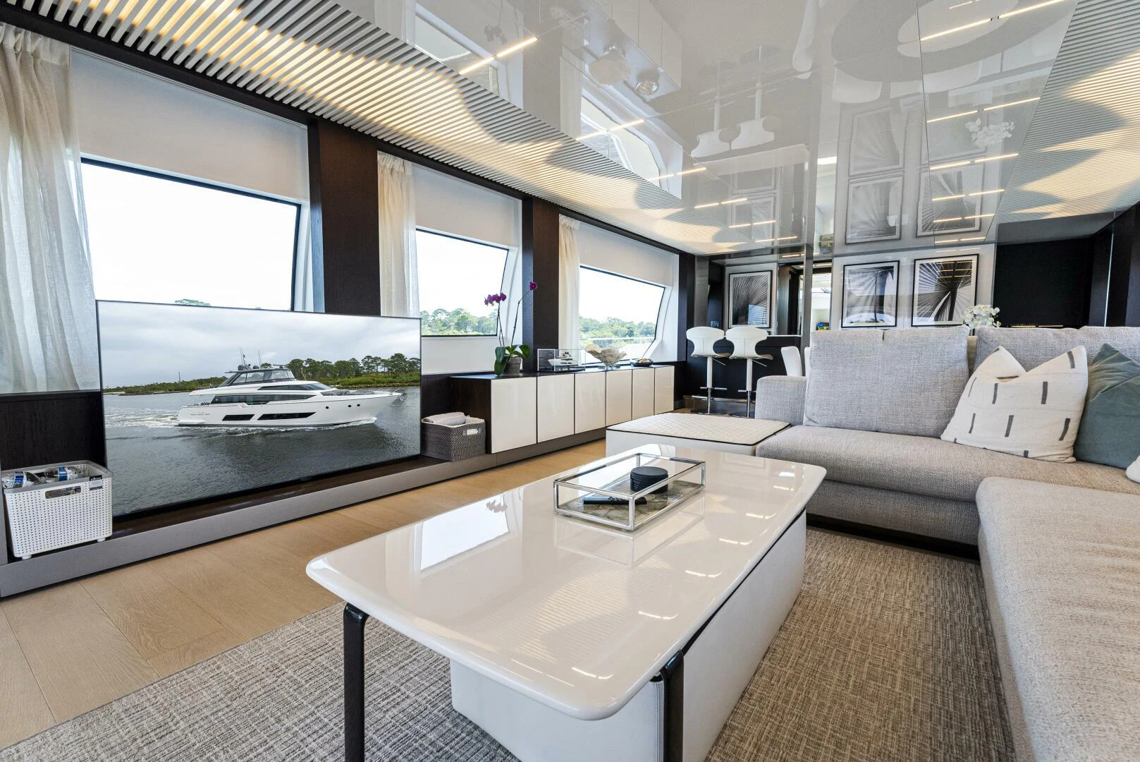 a living room with a large window aboard PINCH ME Yacht for Sale