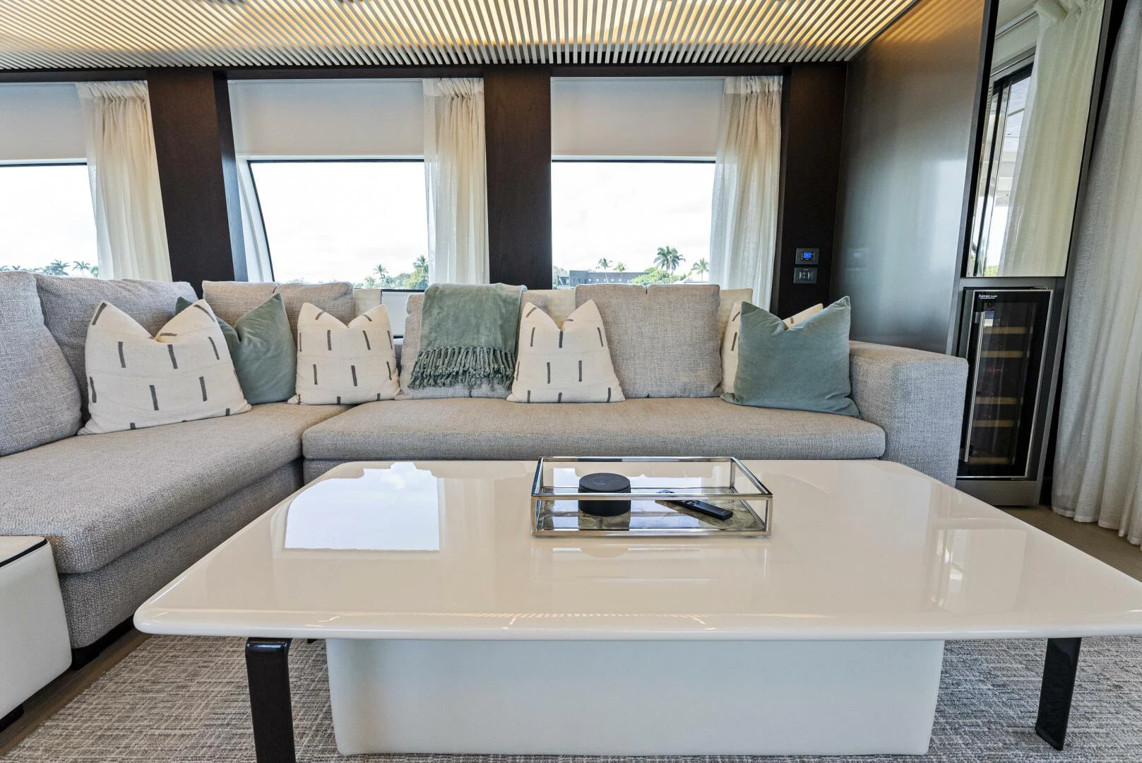 a living room with a couch and coffee table aboard PINCH ME Yacht for Sale