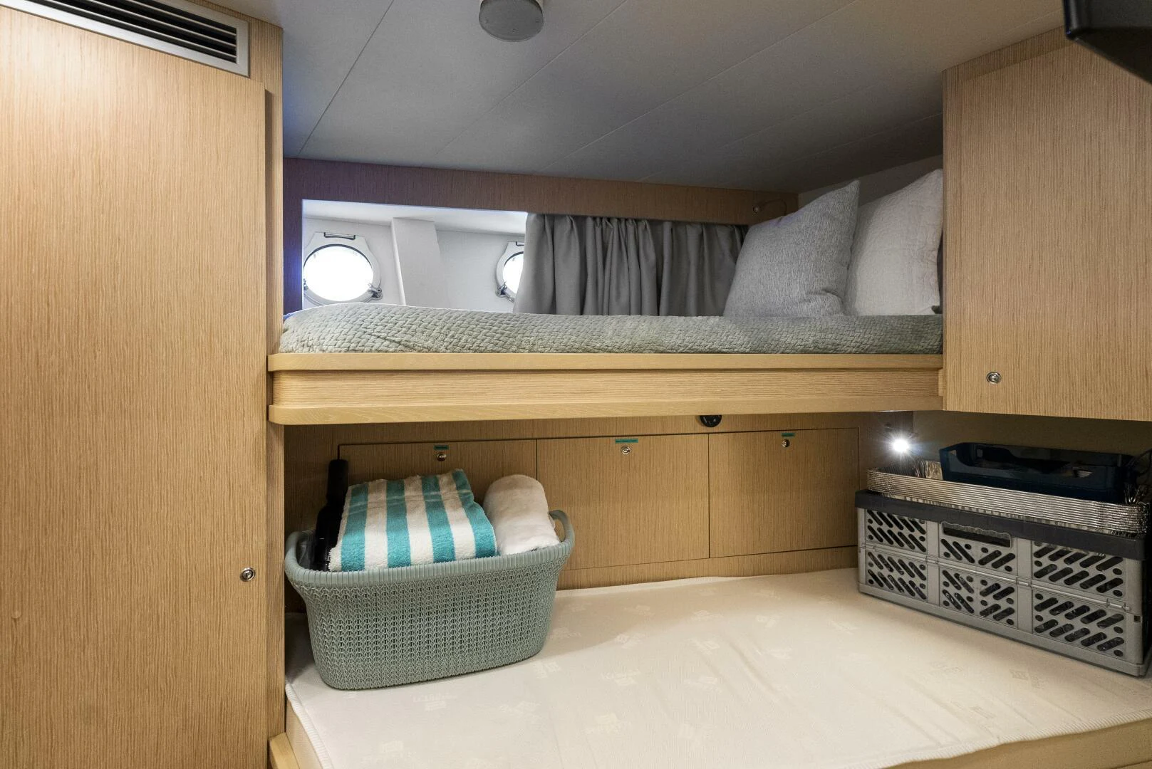 a room with a bed and a microwave aboard PINCH ME Yacht for Sale