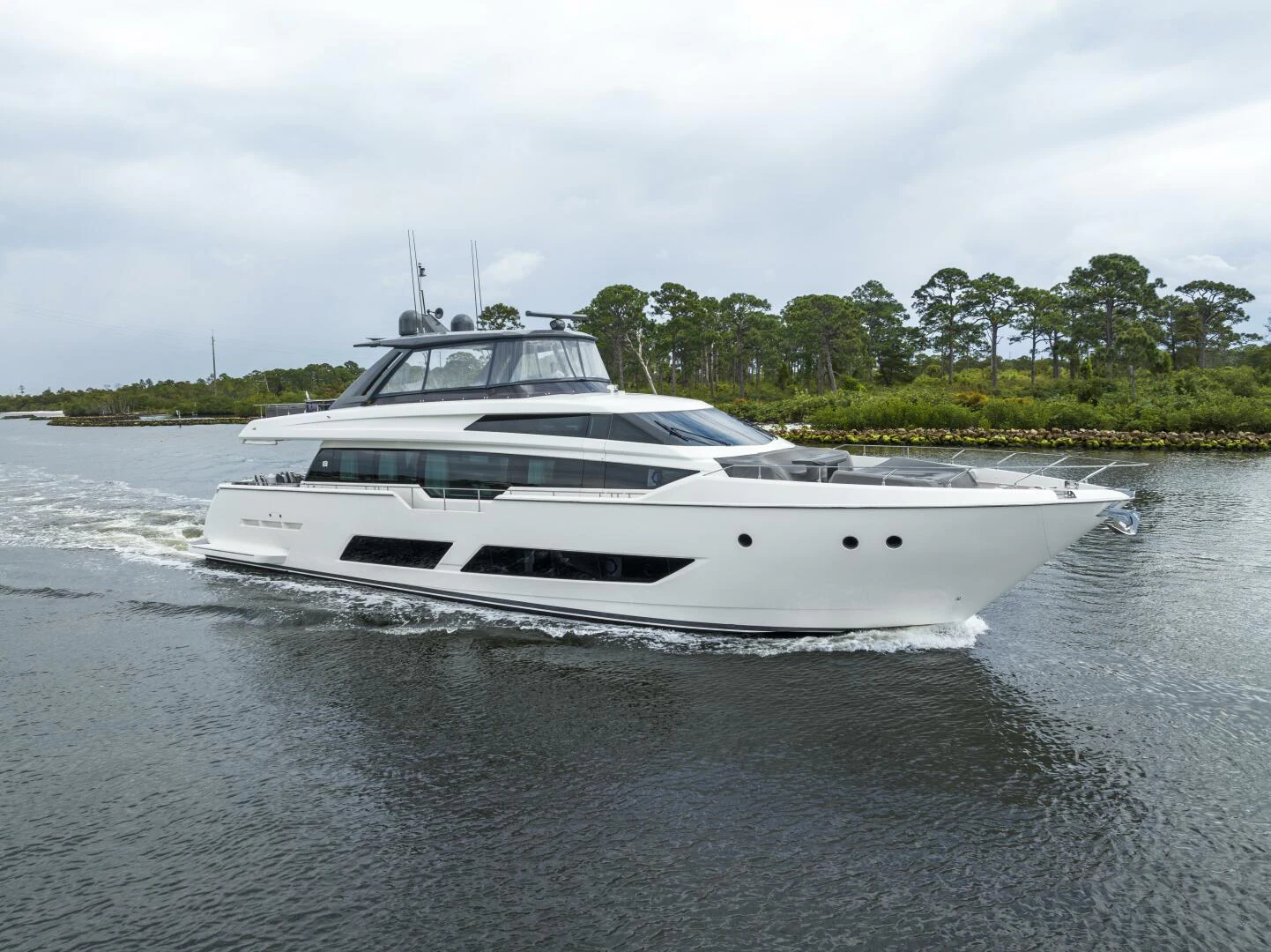a white boat on the water aboard PINCH ME Yacht for Sale