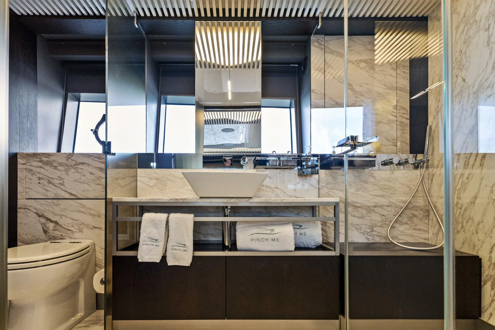 a bathroom with a sink and a mirror aboard PINCH ME Yacht for Sale