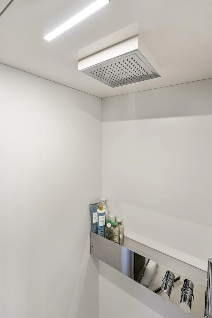 a shelf with bottles and cans on it aboard PINCH ME Yacht for Sale