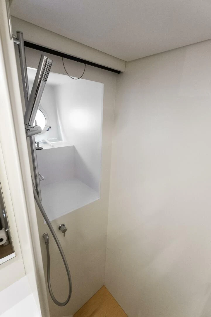 a white wall with a mirror aboard PINCH ME Yacht for Sale