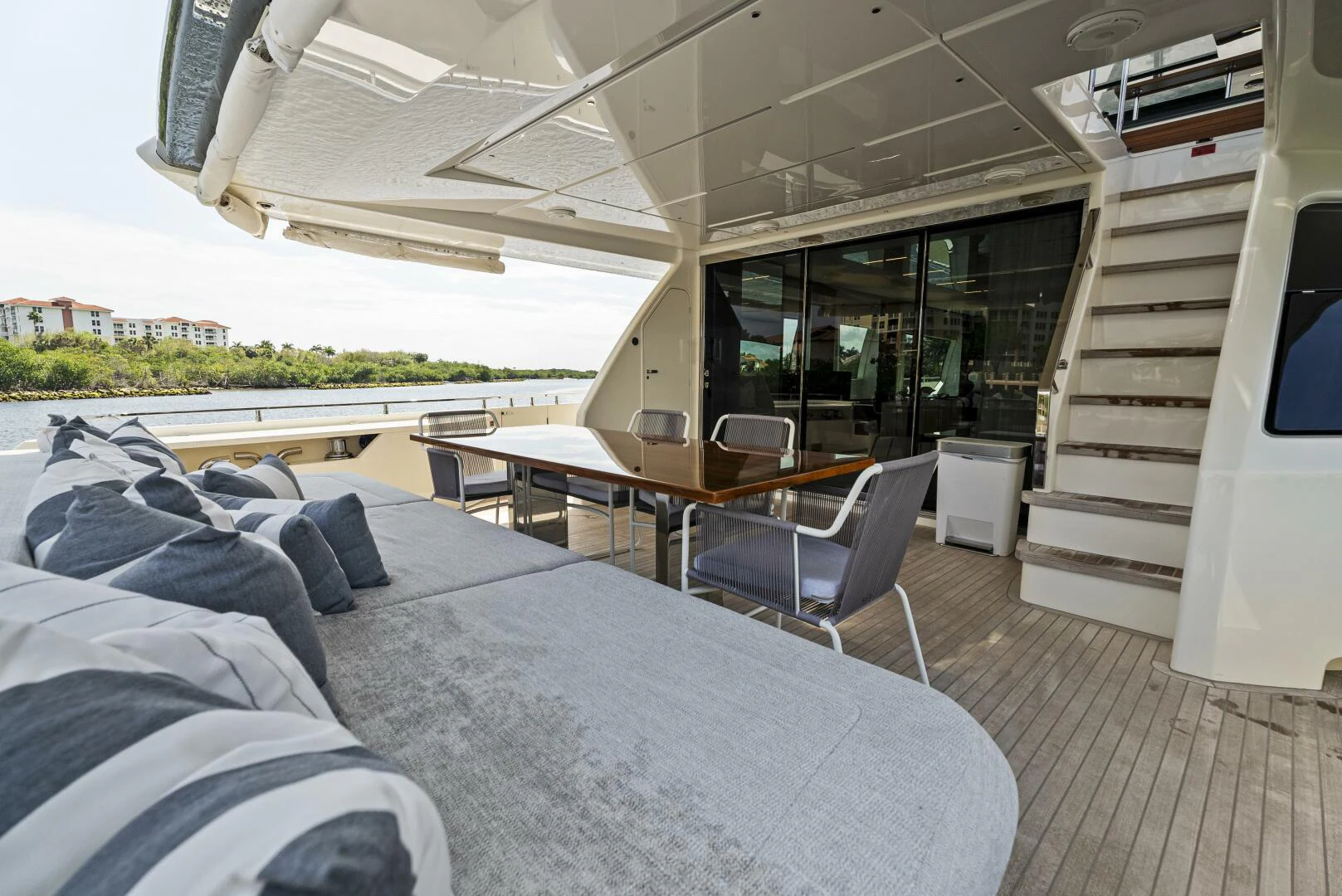 a room with a bed and a table and chairs aboard PINCH ME Yacht for Sale