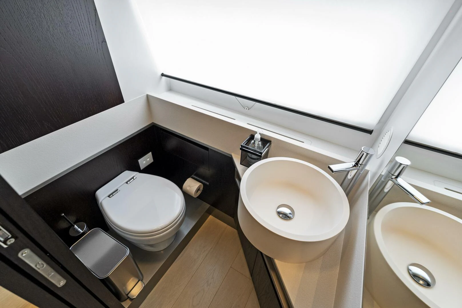a bathroom with a toilet and sink aboard PINCH ME Yacht for Sale