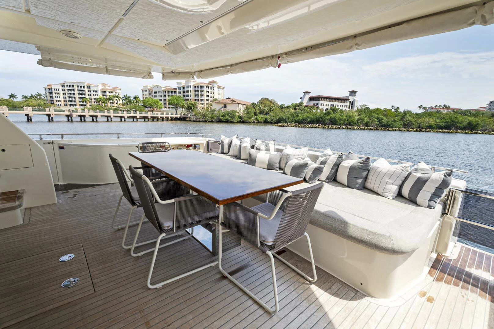 a table and chairs on a deck aboard PINCH ME Yacht for Sale