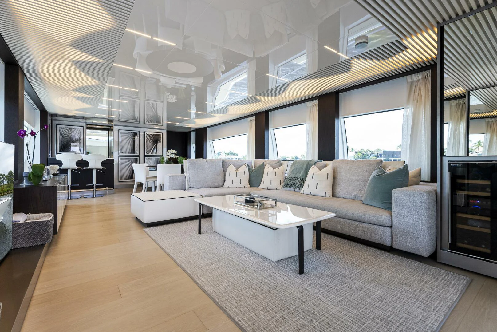 a living room with a large window aboard PINCH ME Yacht for Sale