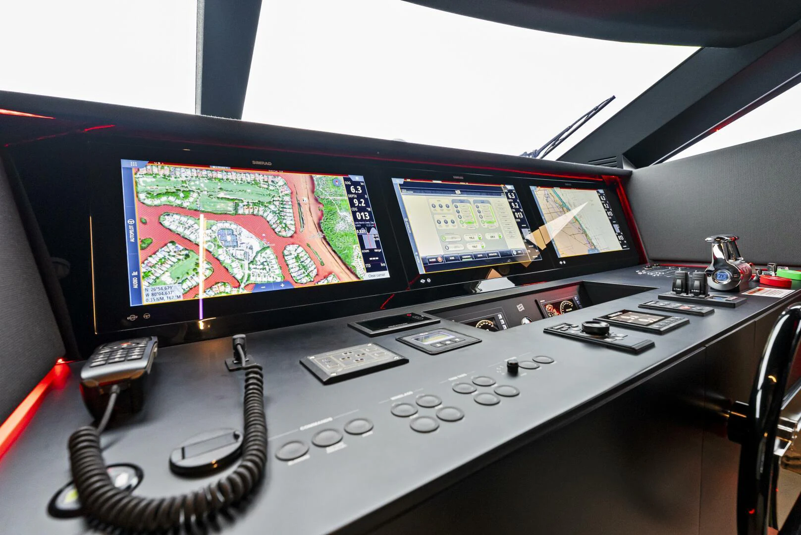 a control panel with multiple monitors aboard PINCH ME Yacht for Sale