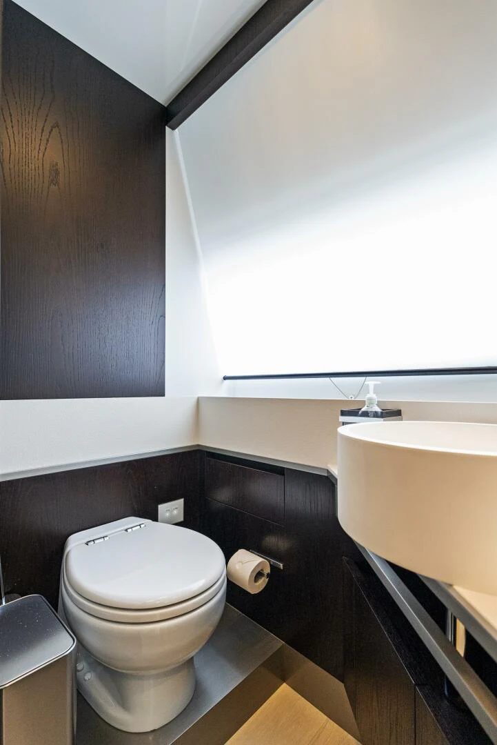 a toilet in a bathroom aboard PINCH ME Yacht for Sale