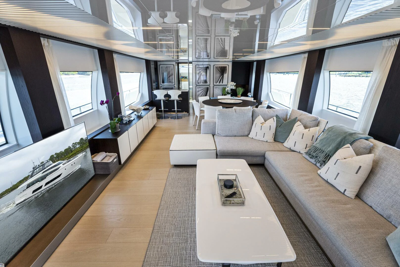 a living room with a large window aboard PINCH ME Yacht for Sale