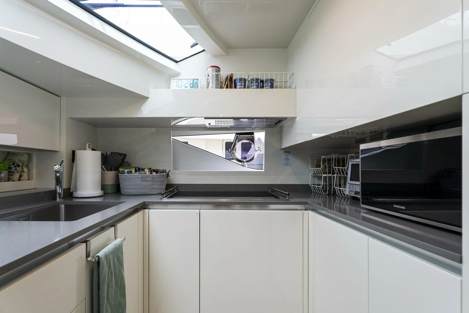 a kitchen with white cabinets aboard PINCH ME Yacht for Sale