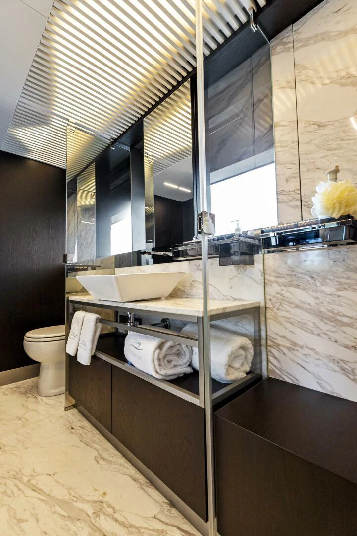 a bathroom with a large mirror aboard PINCH ME Yacht for Sale