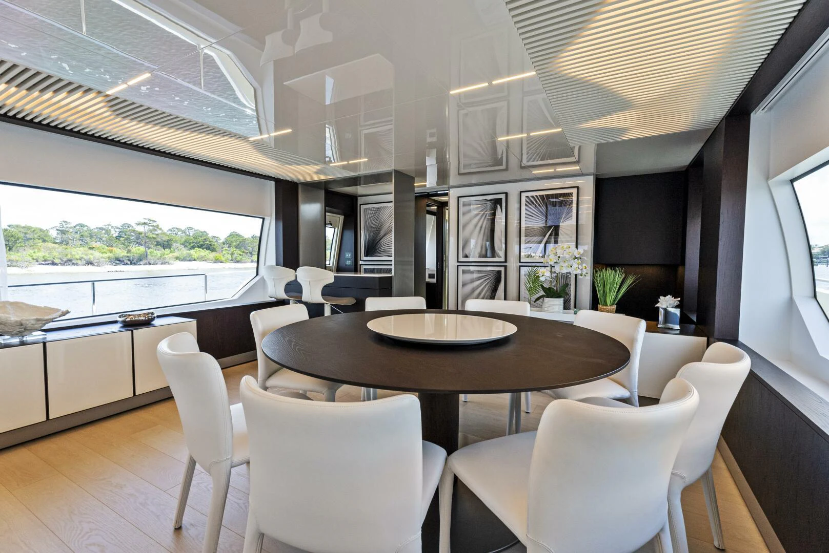 a dining room with a table and chairs aboard PINCH ME Yacht for Sale