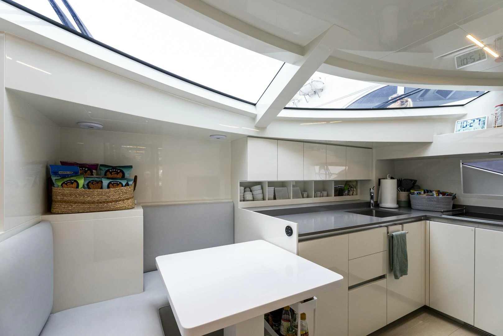 a kitchen with white cabinets aboard PINCH ME Yacht for Sale