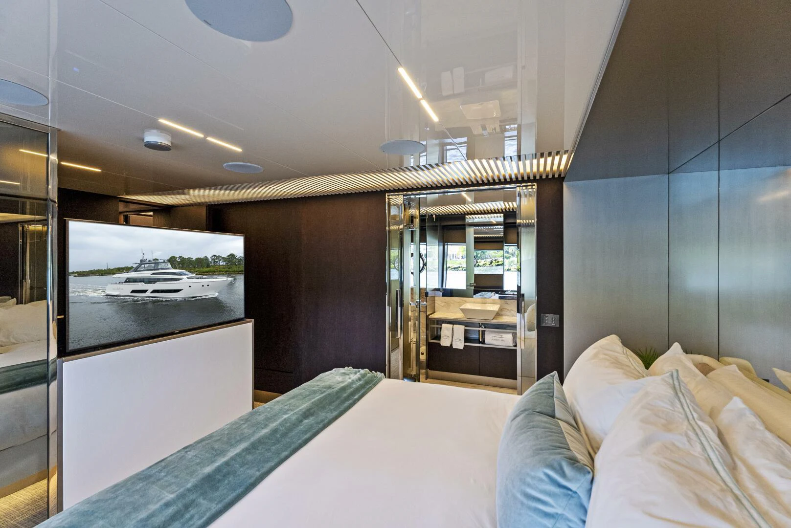 a room with a bed and a glass door aboard PINCH ME Yacht for Sale