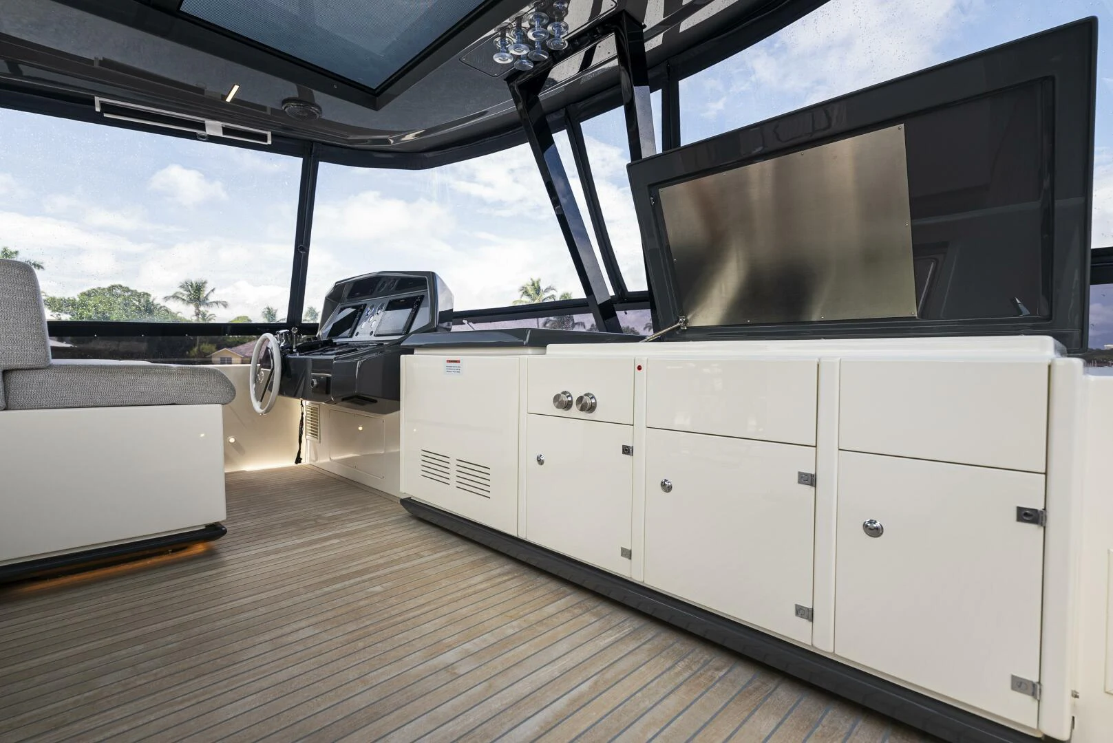 a white vehicle on a wooden deck aboard PINCH ME Yacht for Sale
