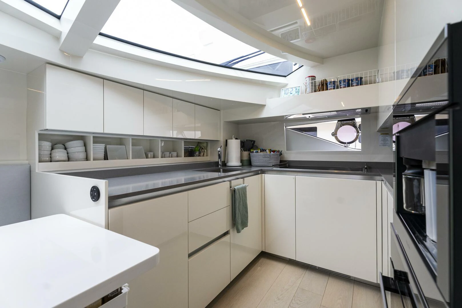 a kitchen with white cabinets aboard PINCH ME Yacht for Sale