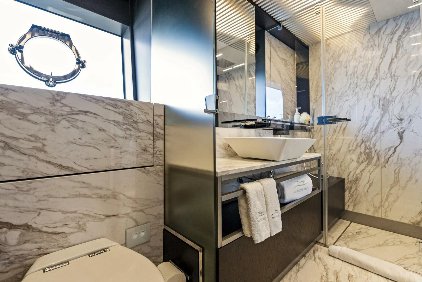 a bathroom with a sink and a toilet aboard PINCH ME Yacht for Sale