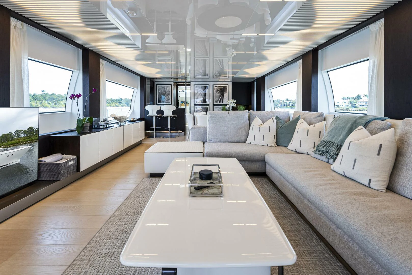 a living room with a couch and a coffee table aboard PINCH ME Yacht for Sale