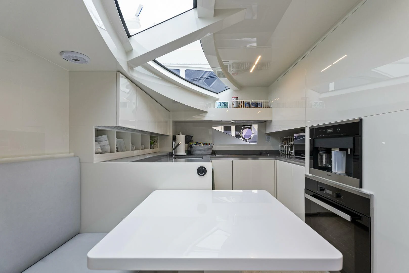 a kitchen with a table aboard PINCH ME Yacht for Sale