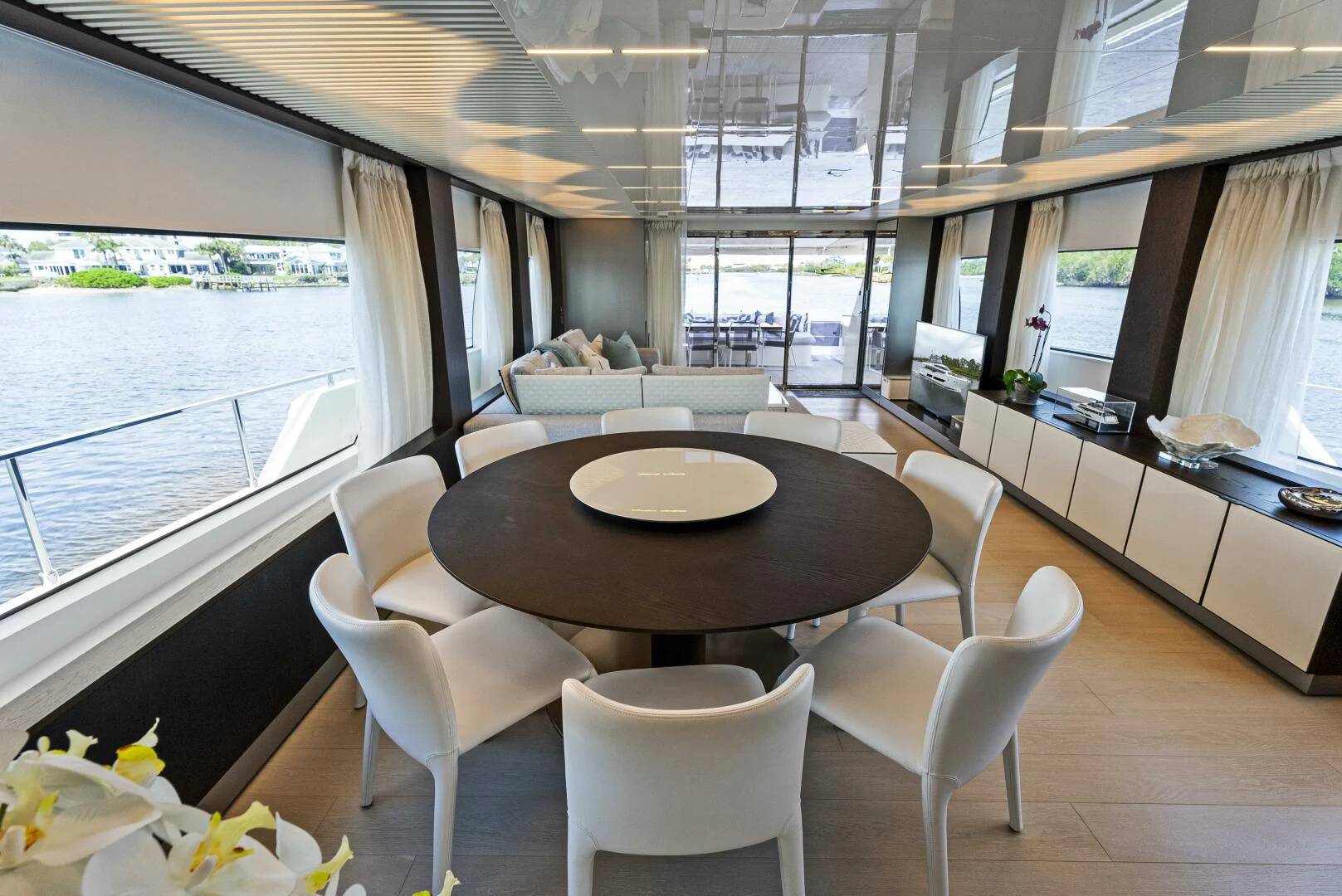 a room with a table and chairs aboard PINCH ME Yacht for Sale