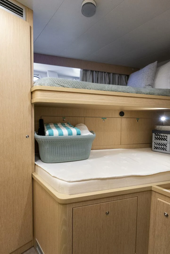 a shelf with a towel and a basket on it aboard PINCH ME Yacht for Sale