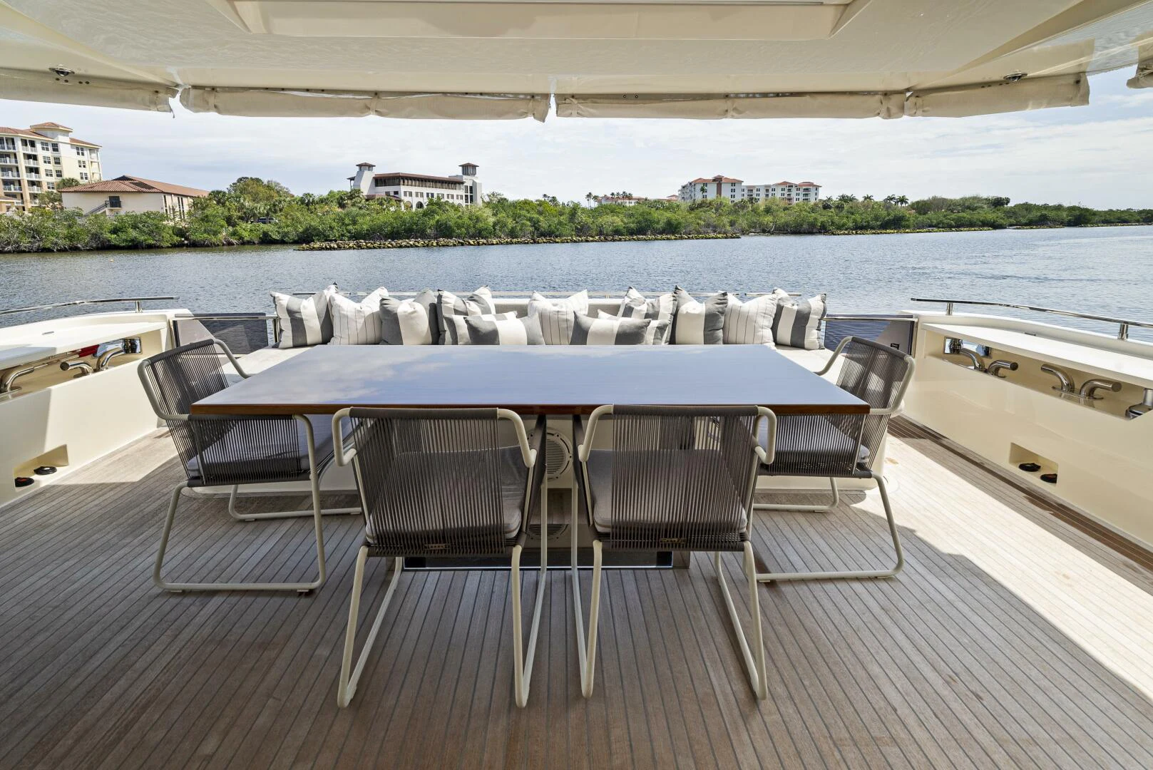 a table and chairs on a deck aboard PINCH ME Yacht for Sale