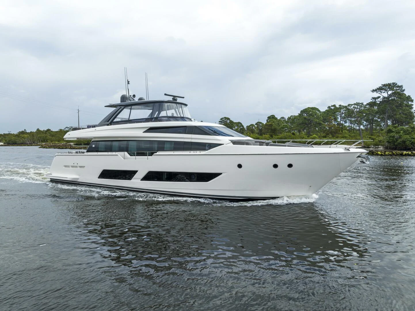 a white yacht on the water aboard PINCH ME Yacht for Sale