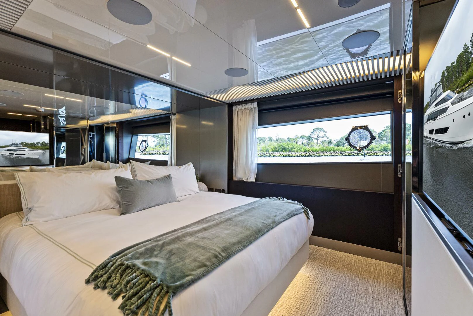 a room with a bed and a window aboard PINCH ME Yacht for Sale