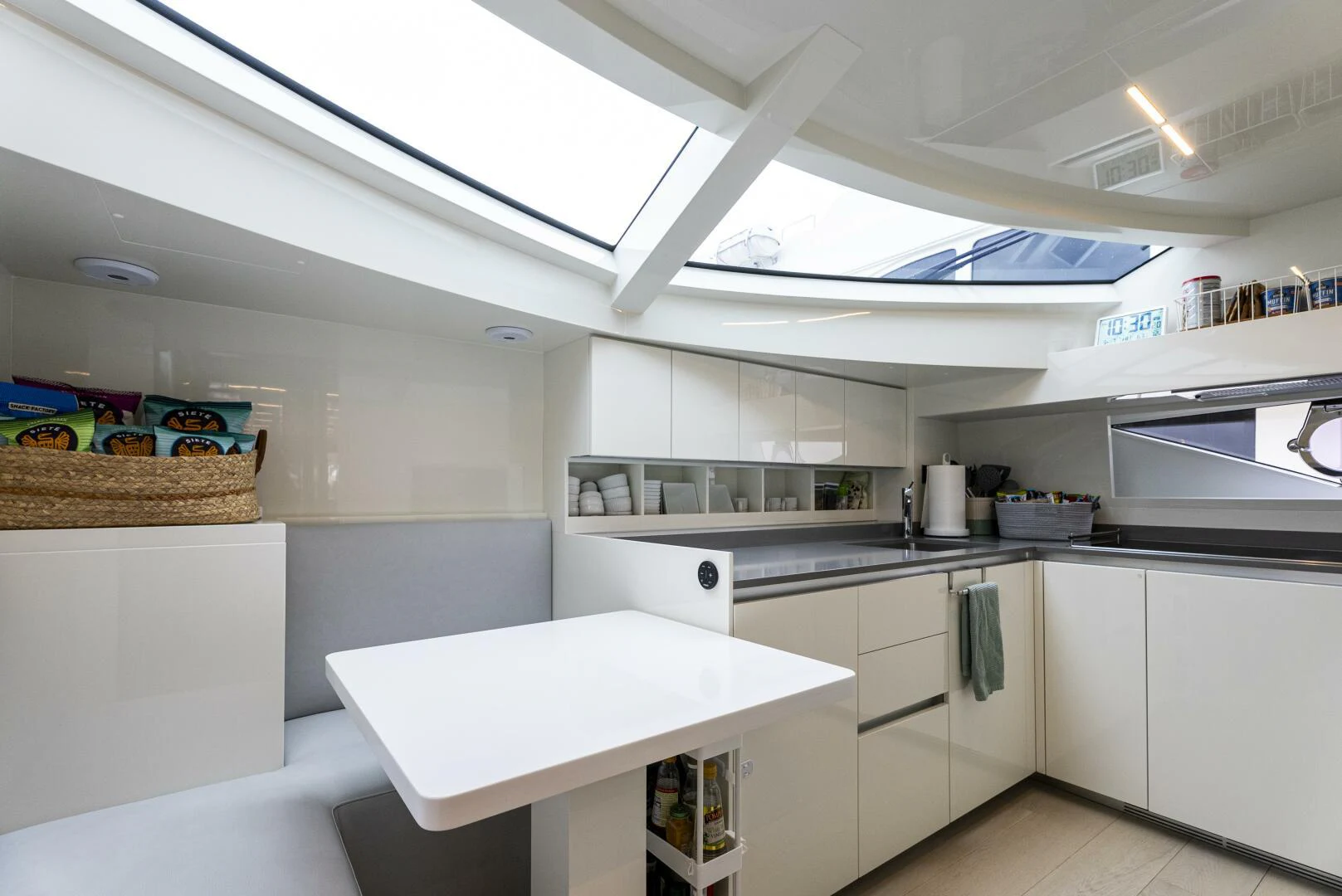 a kitchen with white cabinets aboard PINCH ME Yacht for Sale
